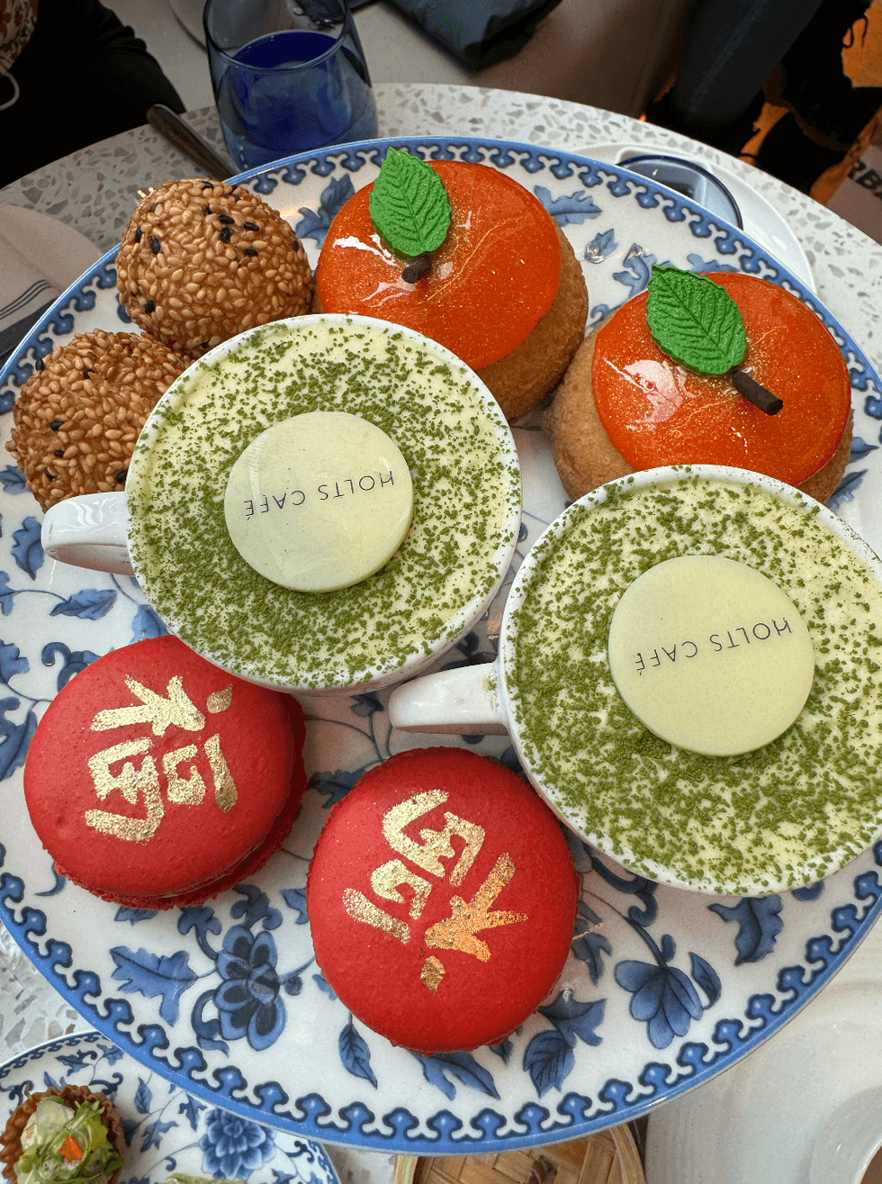 Three different desserts on a plate.