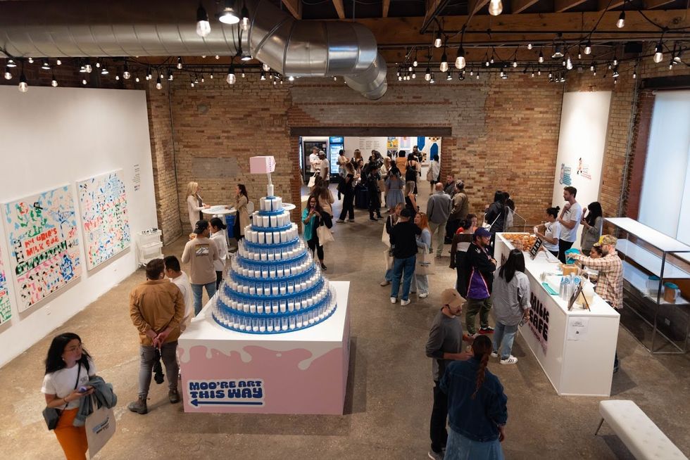 Visitors milling around artworks at the Moo'seum of Modern Milk.