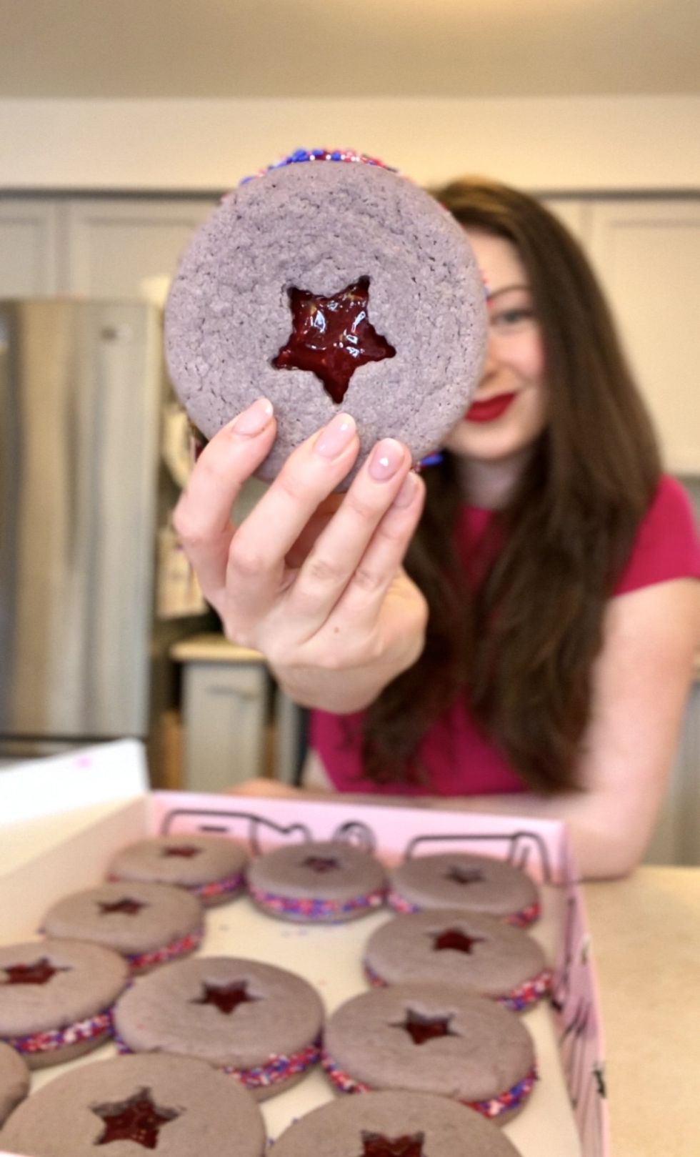 Madeline holding a cookie.
