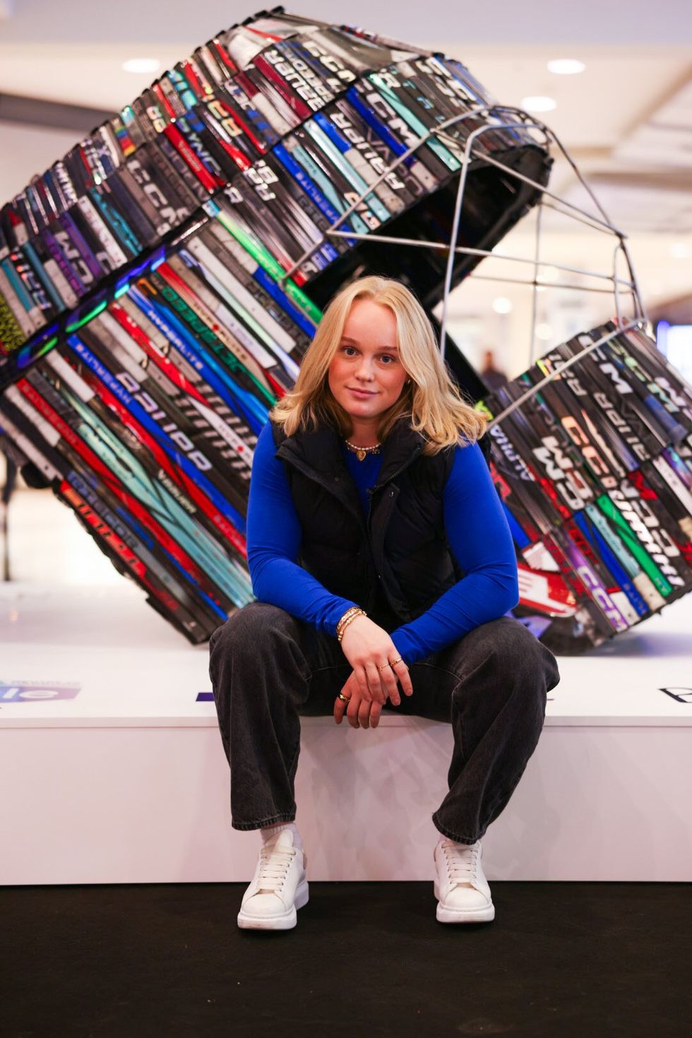 Toronto Sceptres' Emma Maltais in front of "The Inaugural Six" by Briony Douglas.