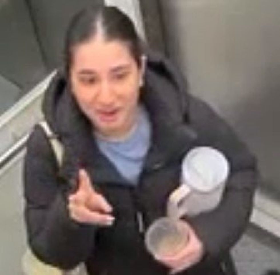 A woman in an elevator.