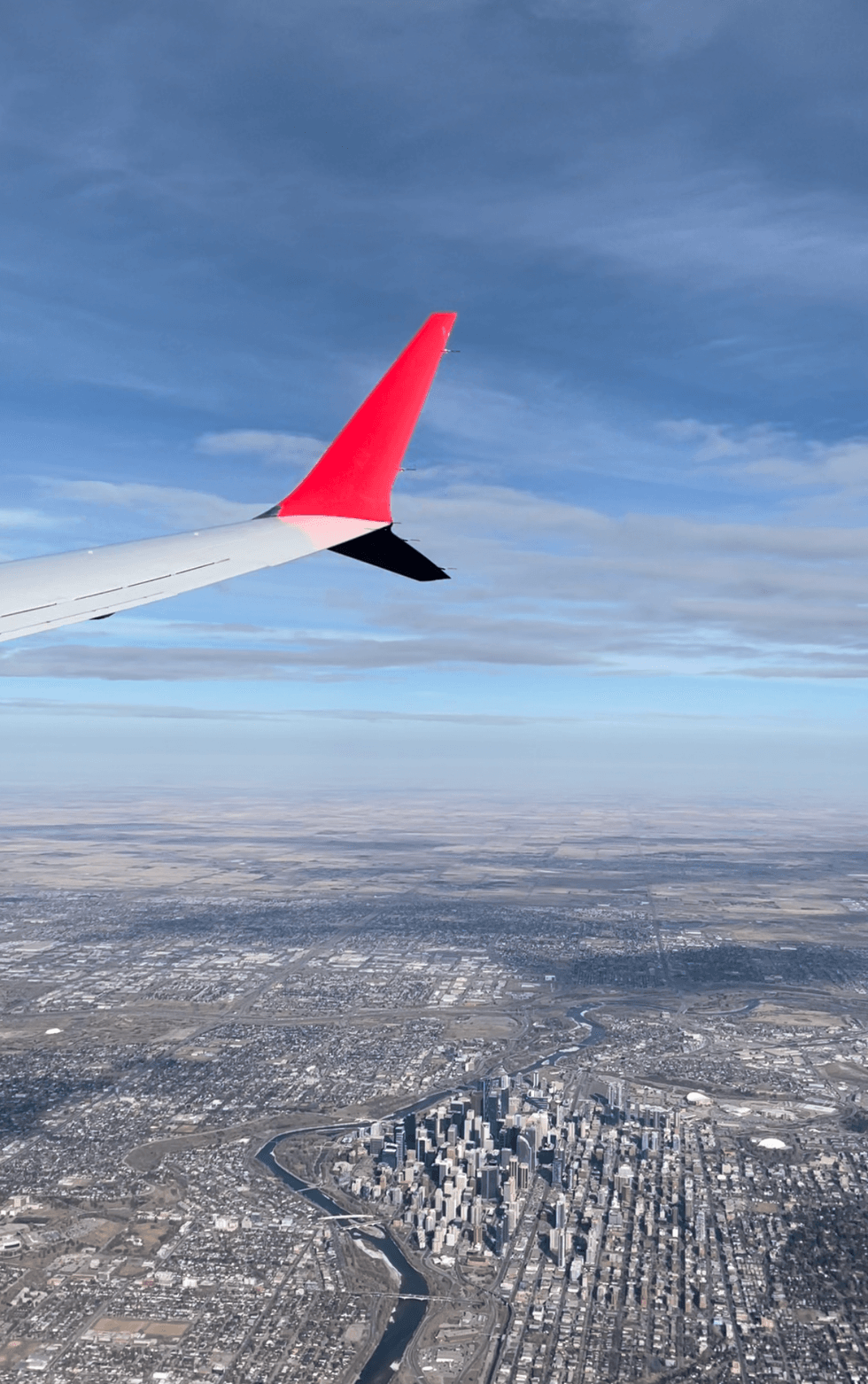 The view out of the plane window over Calgary.