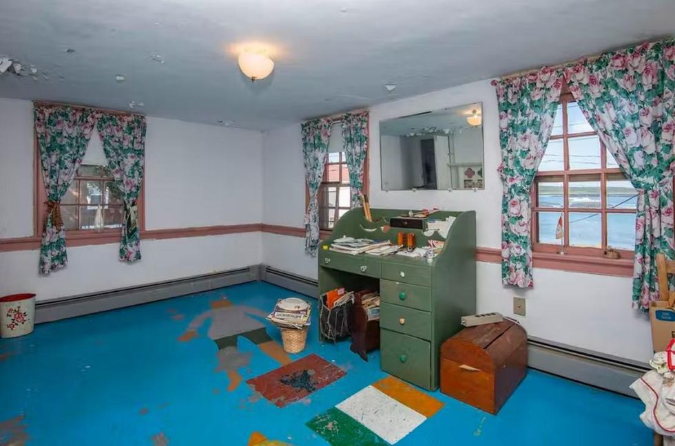 One of the front rooms with an Irish and an Albanian flag painted on the floor.