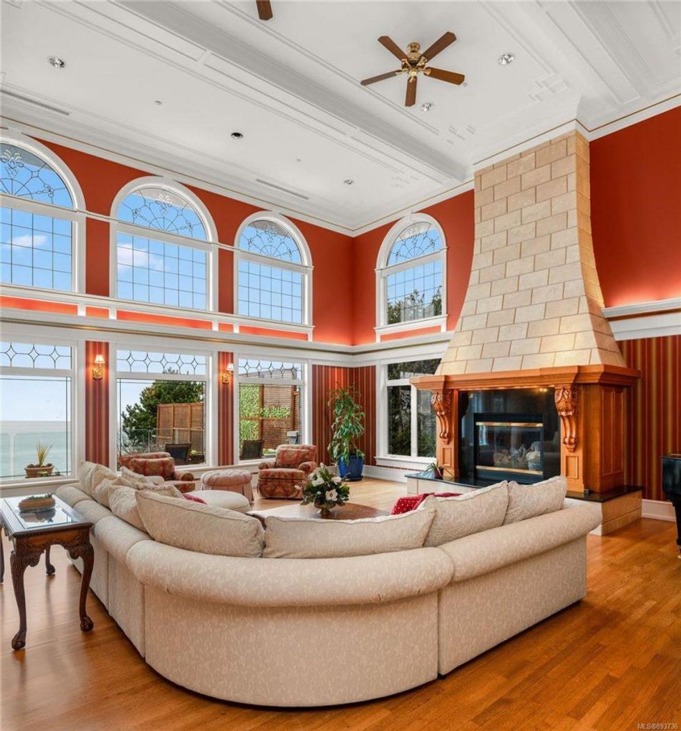 The living room with fireplace and ocean view.