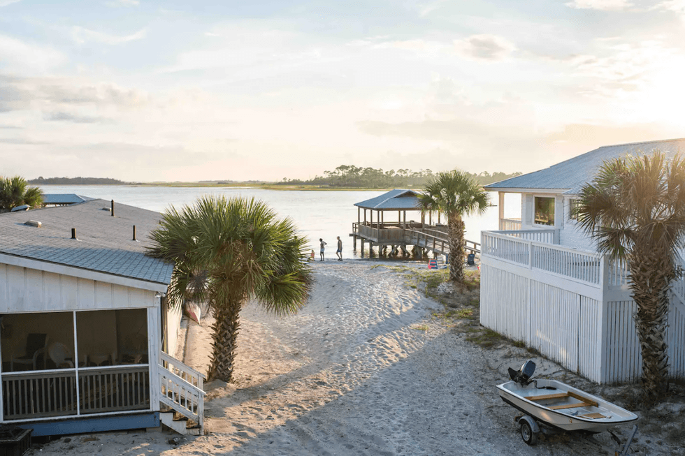 The beach outside the back porch of Back Beach: Hidden Gem Airbnb.