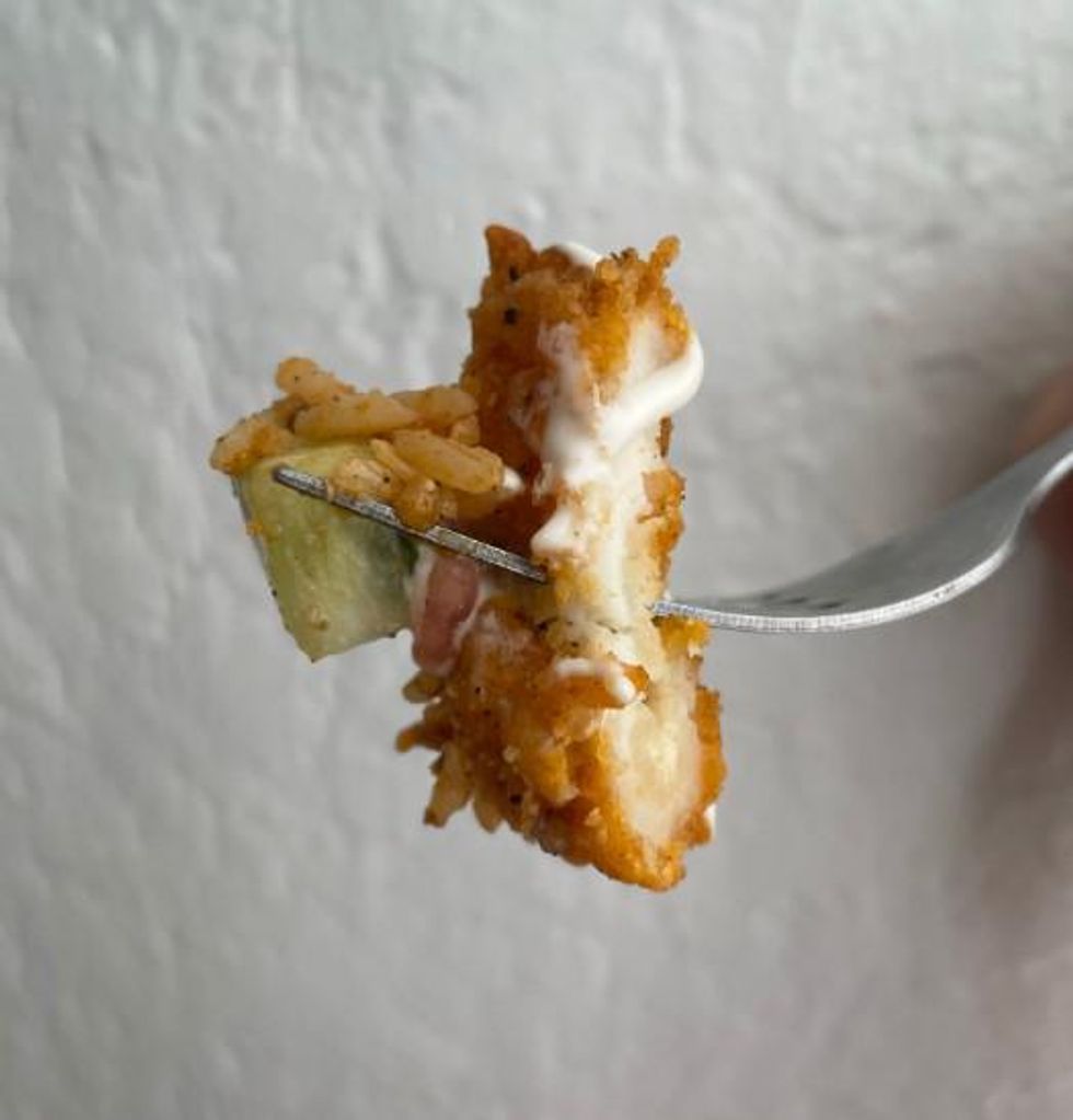 A piece of the chicken on a fork.