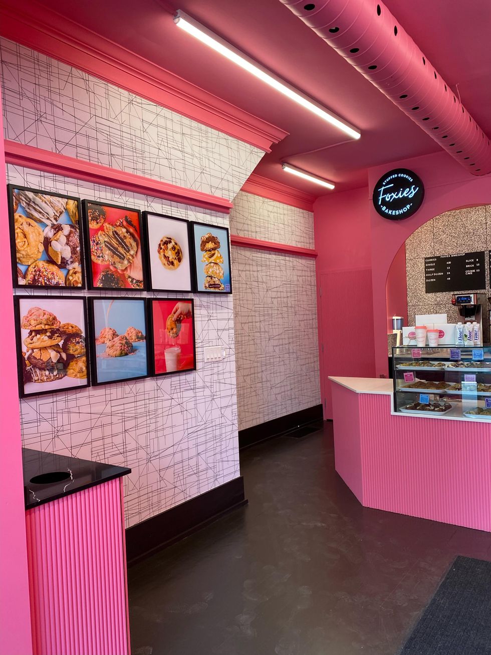 Foxies bakeshop with cookie photos on the wall.