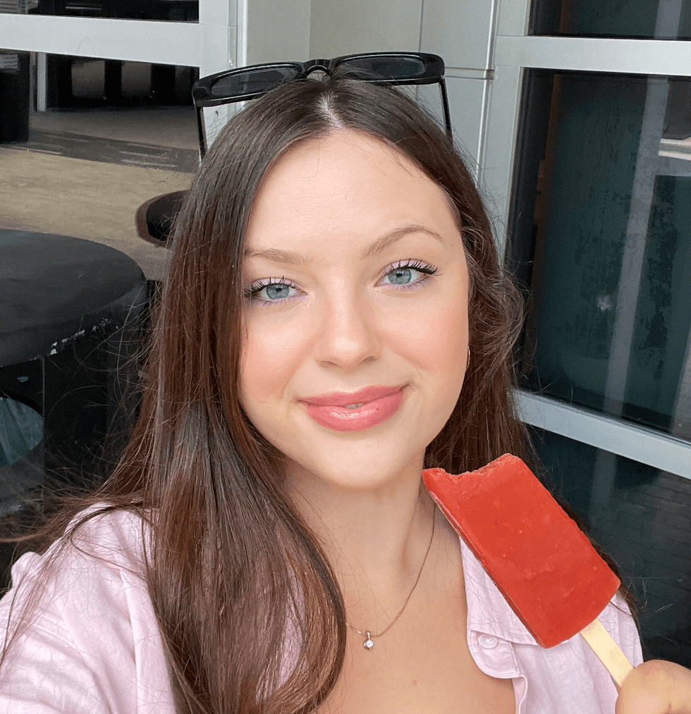 Brooke Houghton eating a French's ketchup popsicle.