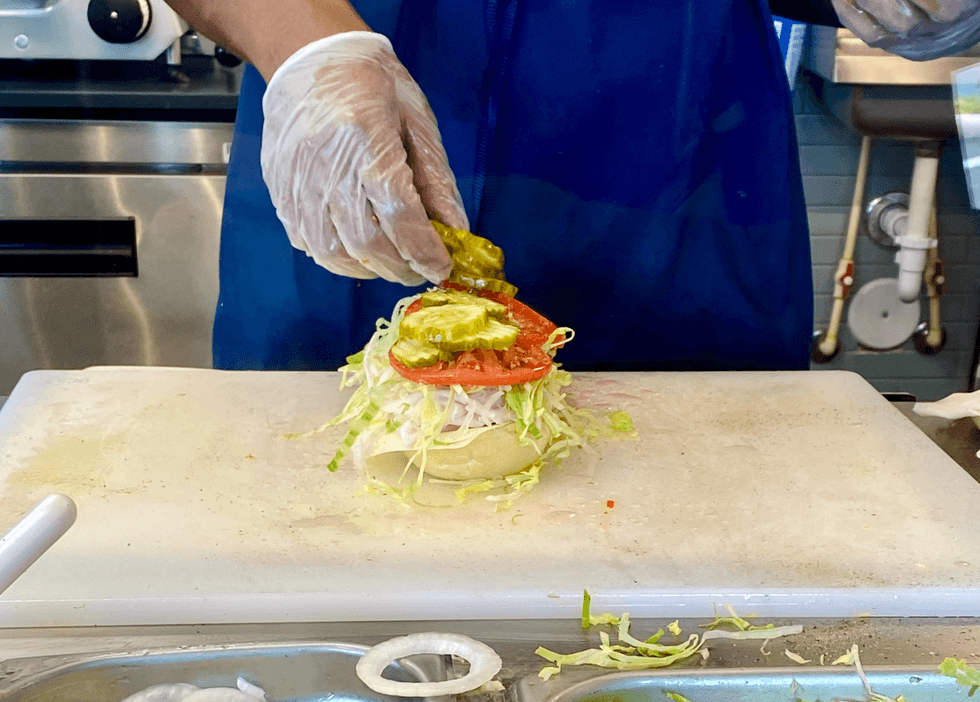 The sub making process at Jersey Mike's.