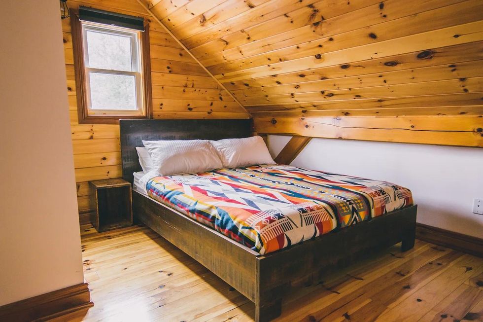 Airbnb cottage bedroom with queen sized bed and new mattress.