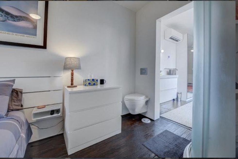 Bedroom with toliet inside.