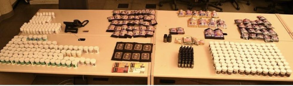 Two tables full of confiscated Psilocybin-related goods.