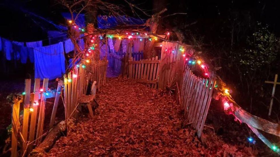 Haunted forest trail lined with Christmas lights.