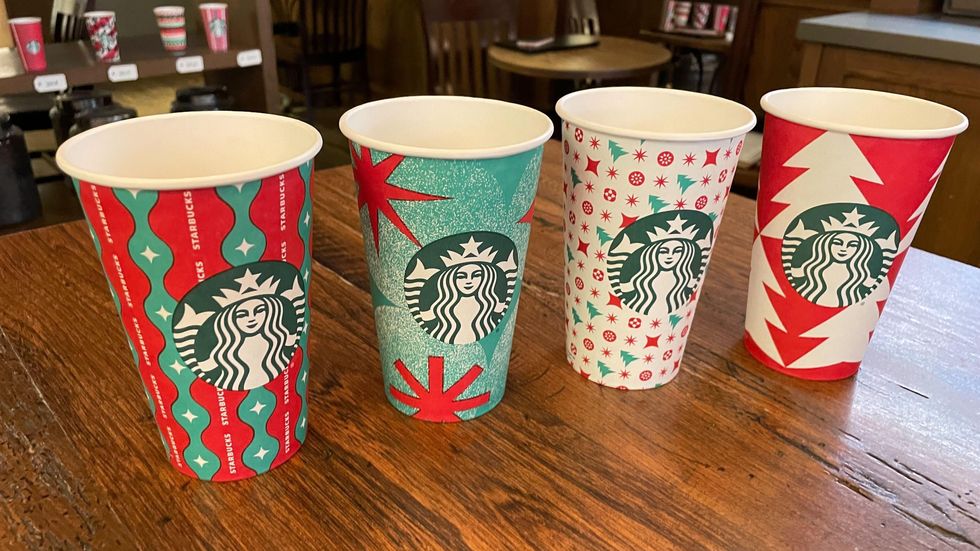 Starbucks holiday cups Gift Wrapped Magic, Frosted Sparkle, Ornament Wonder and Cozy Evergreen.