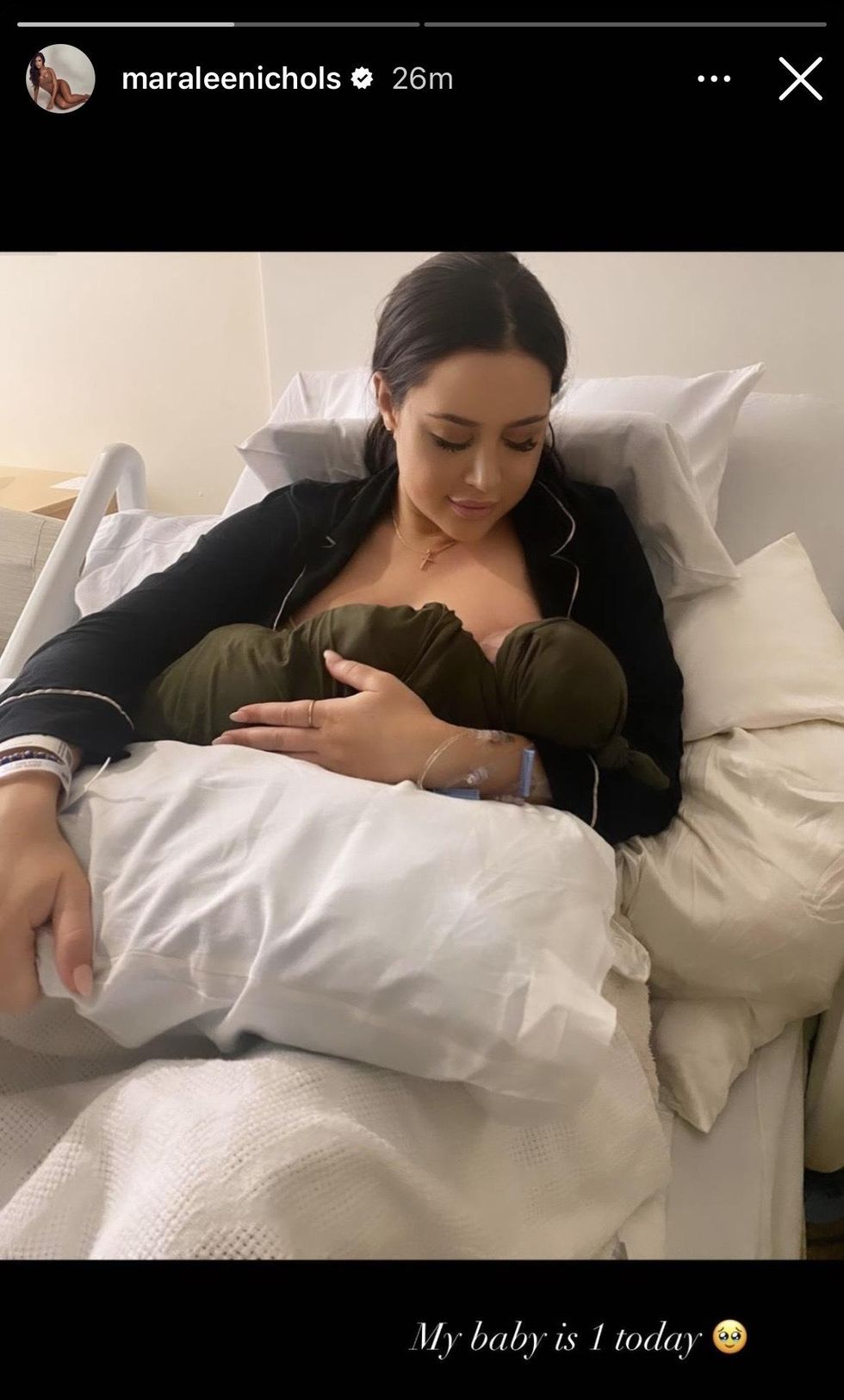 Nichols holding her son in a hospital bed.