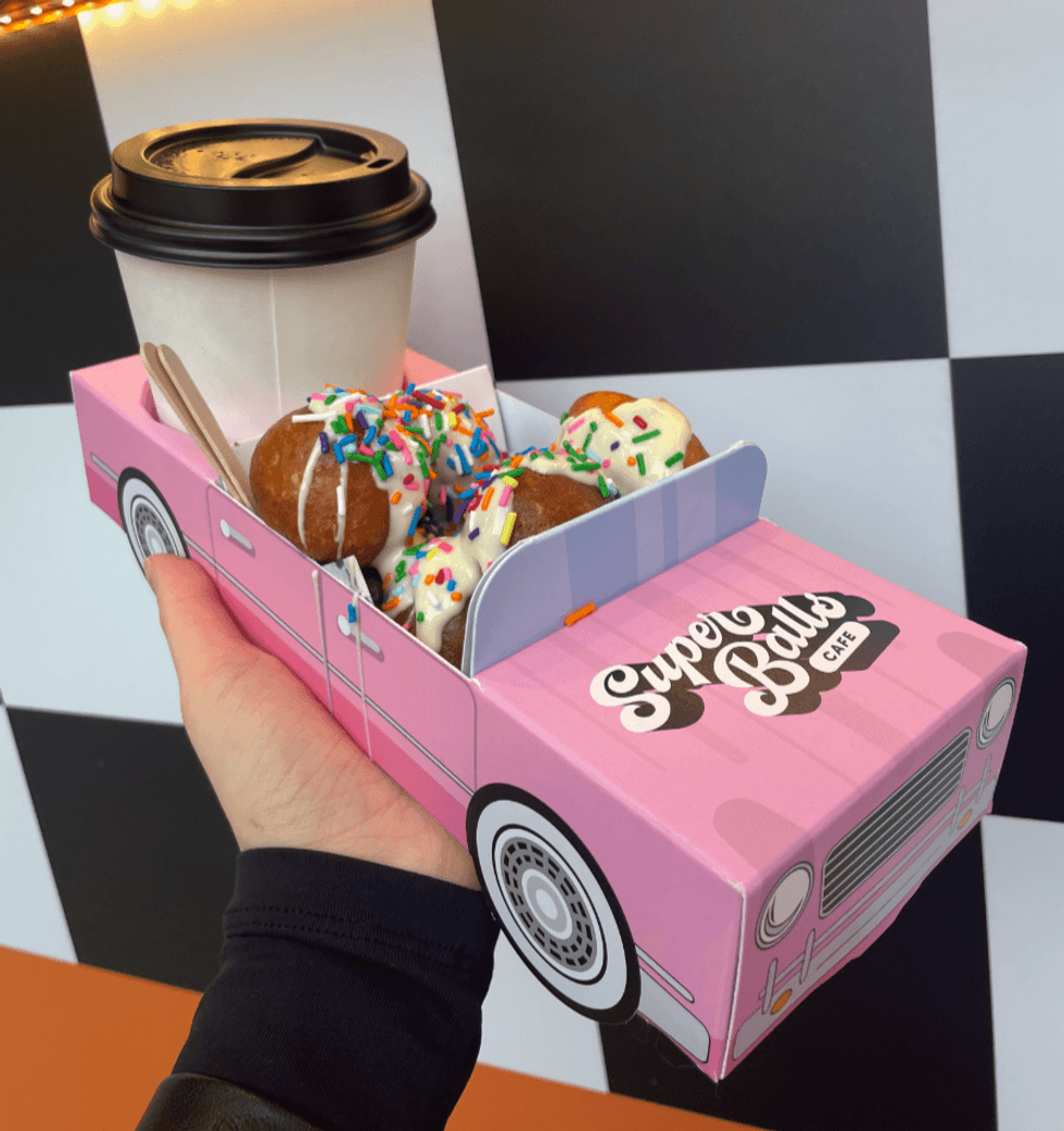 A Superballs Cafe vintage donut car with "Ready, Set, Birthday" donuts.