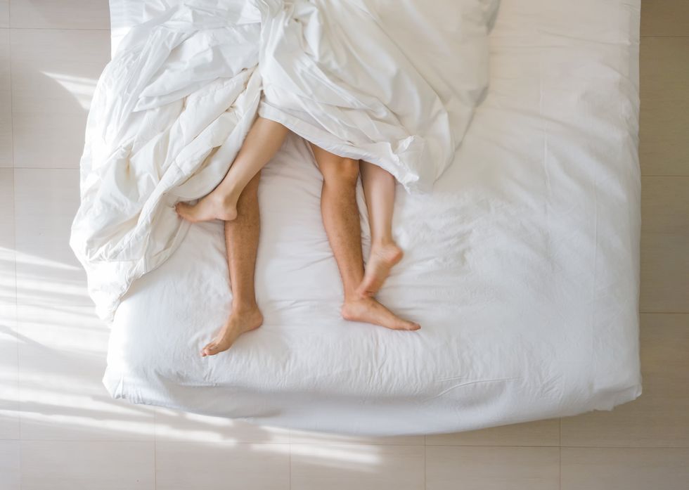 Two people in bed.